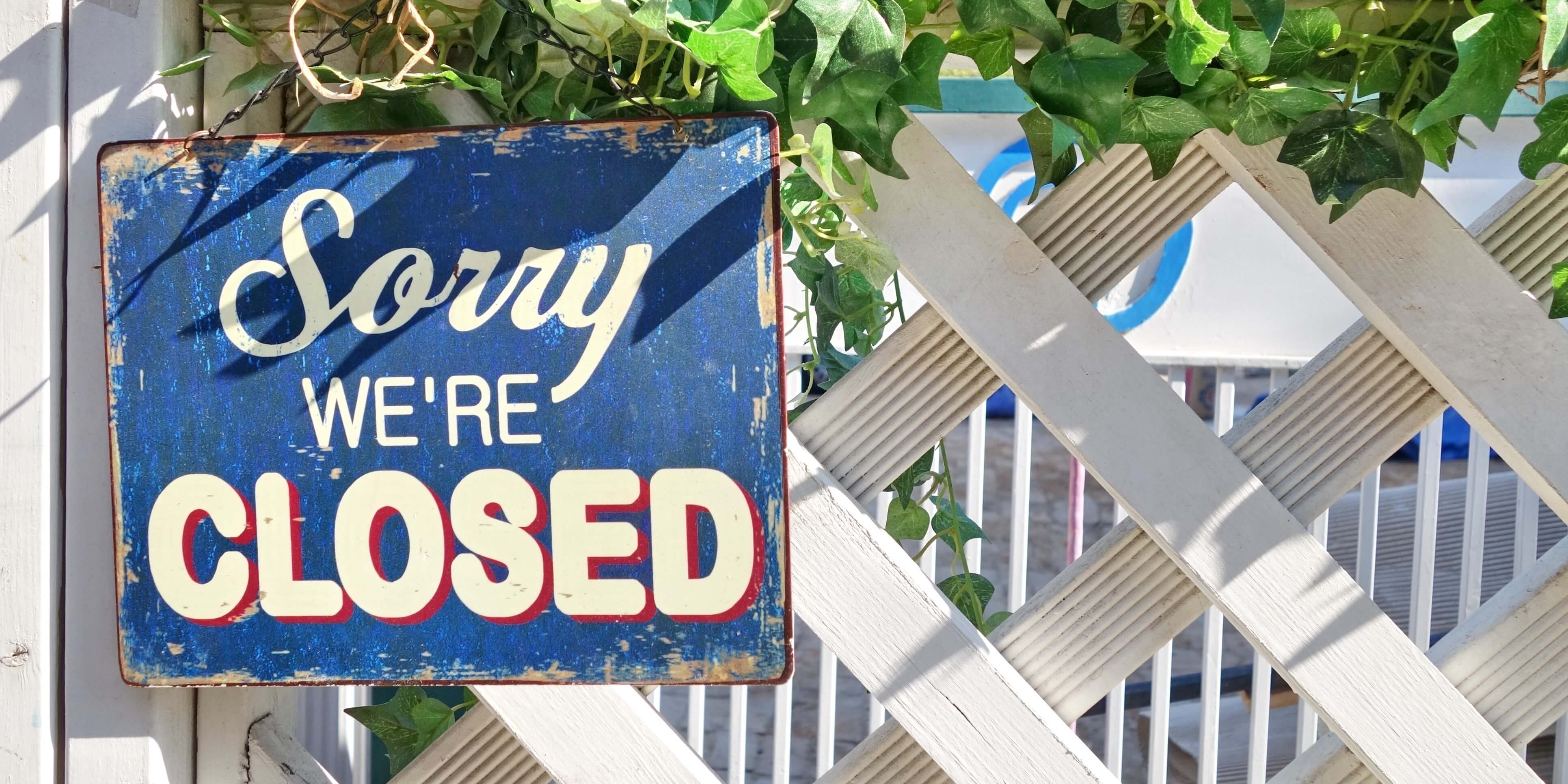 Old Blue Sorry Were Closed Sign On White Fenceshutterstock271510979 8762